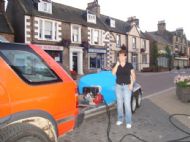 Jaki Gardner helping me water High St flowers